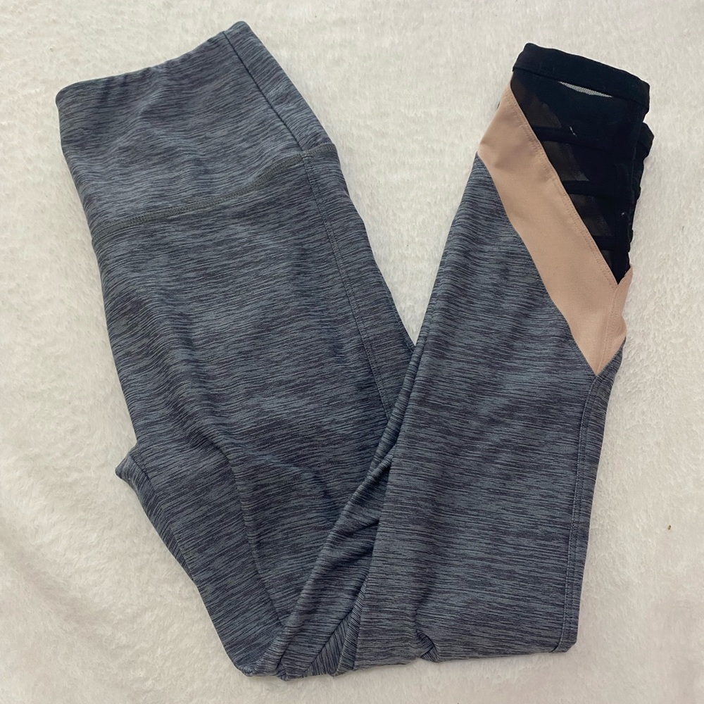 Pink leggings with mesh window on ankle